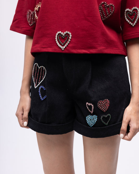 Pleated denim shorts with multi-colour embellished hearts