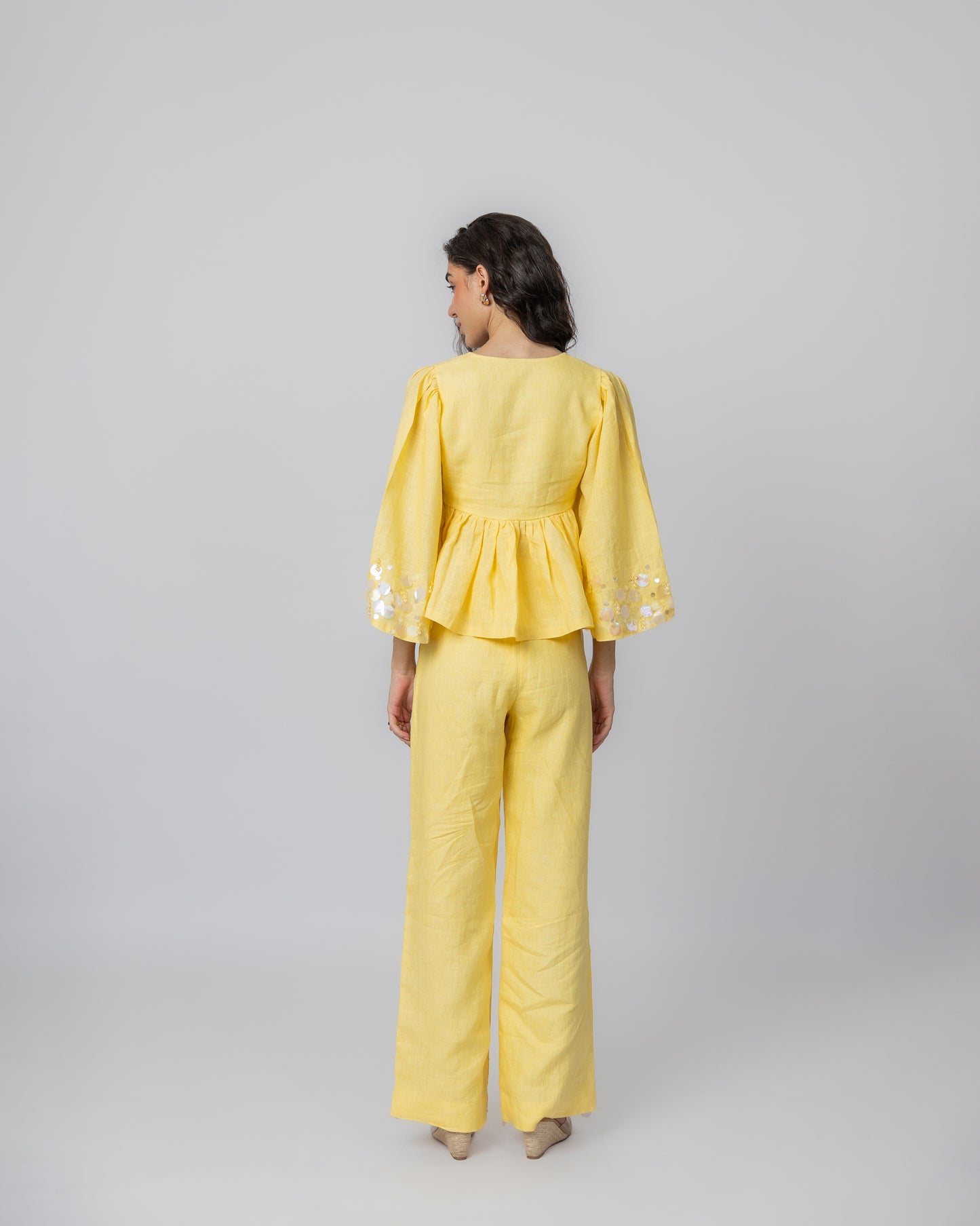 100% Linen long-sleeved beaded peplum with sequin detailing