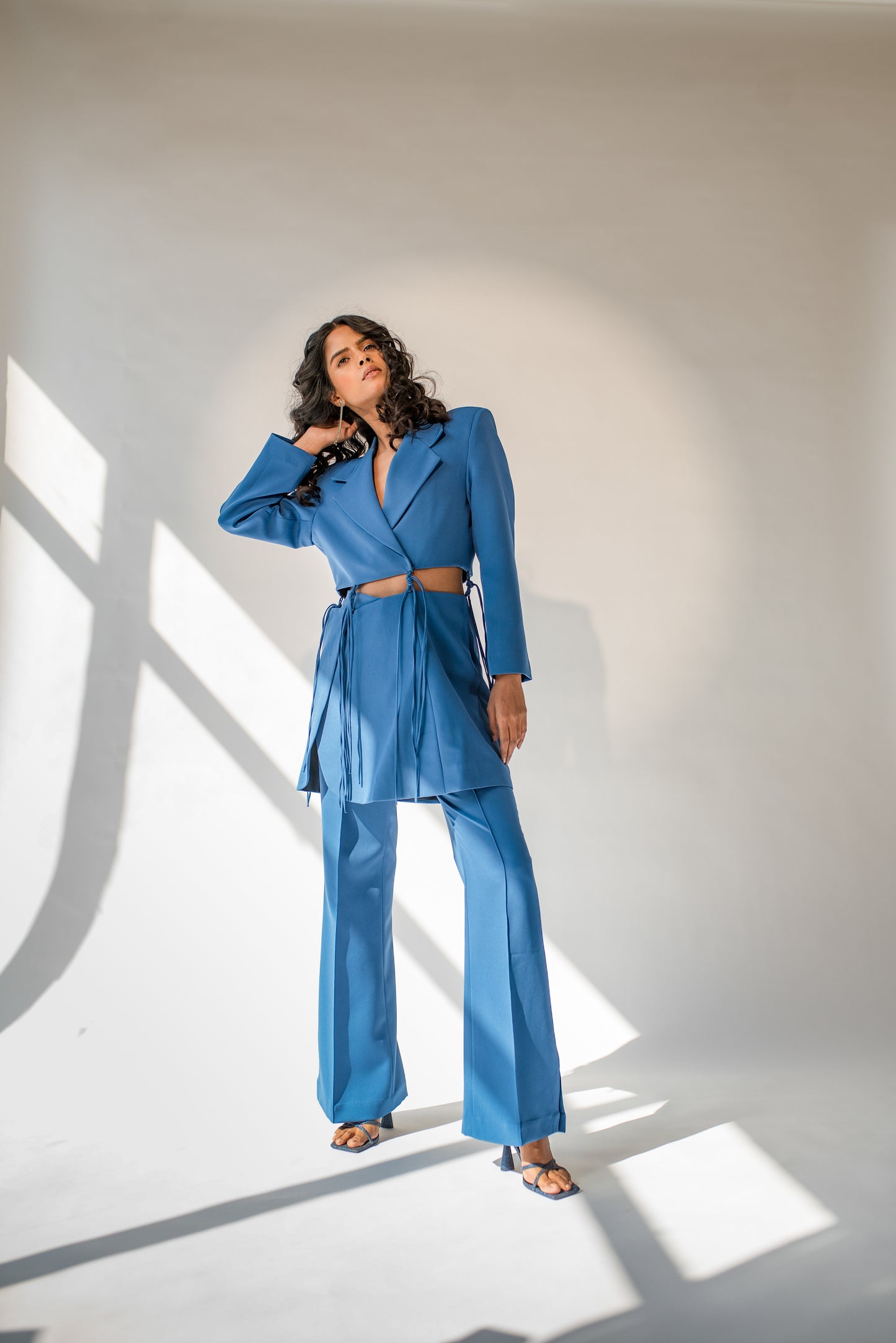 High-waist trousers with side slits