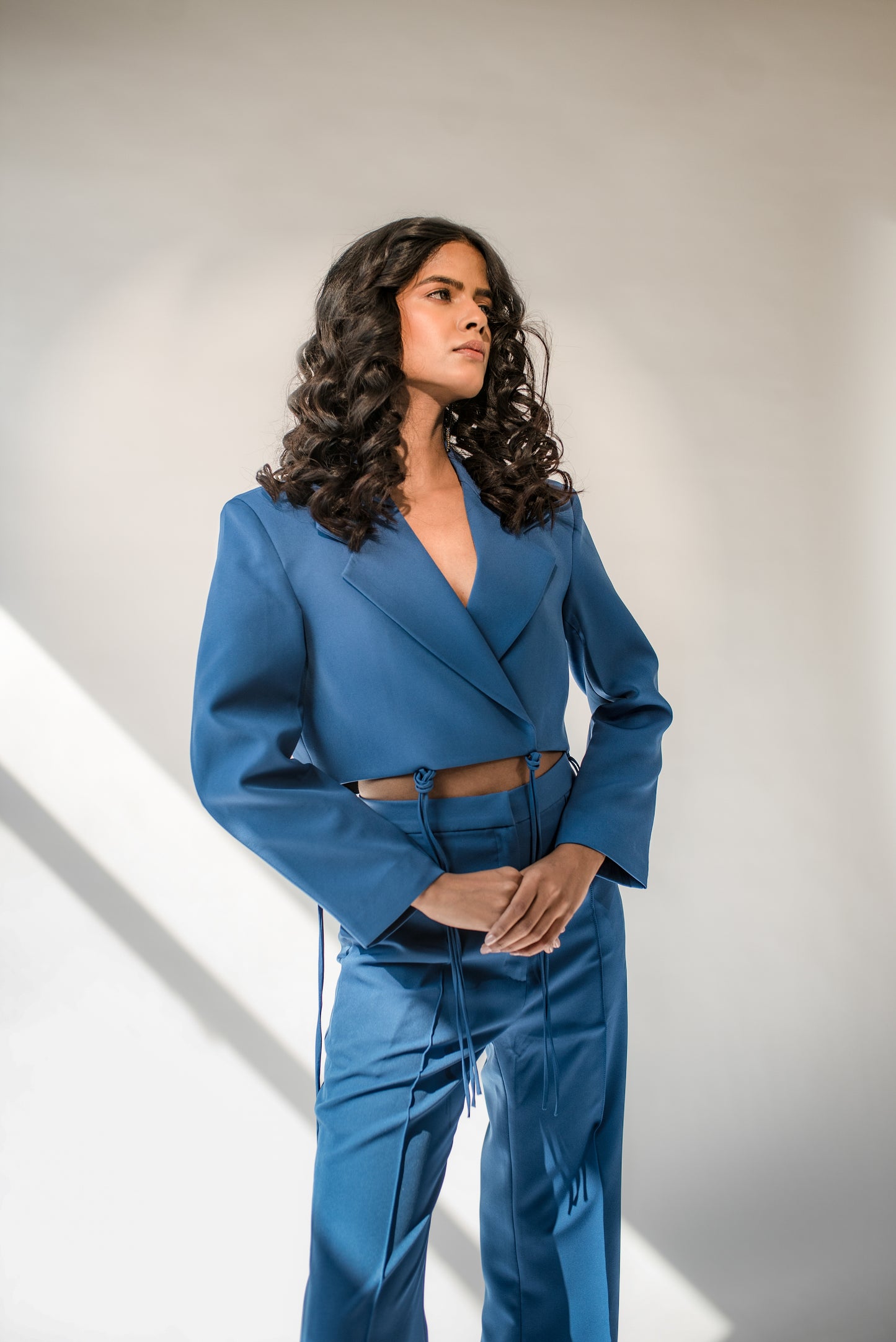 High-waist trousers with side slits