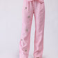 100% linen high-waisted trousers with floral hand-embroidery
