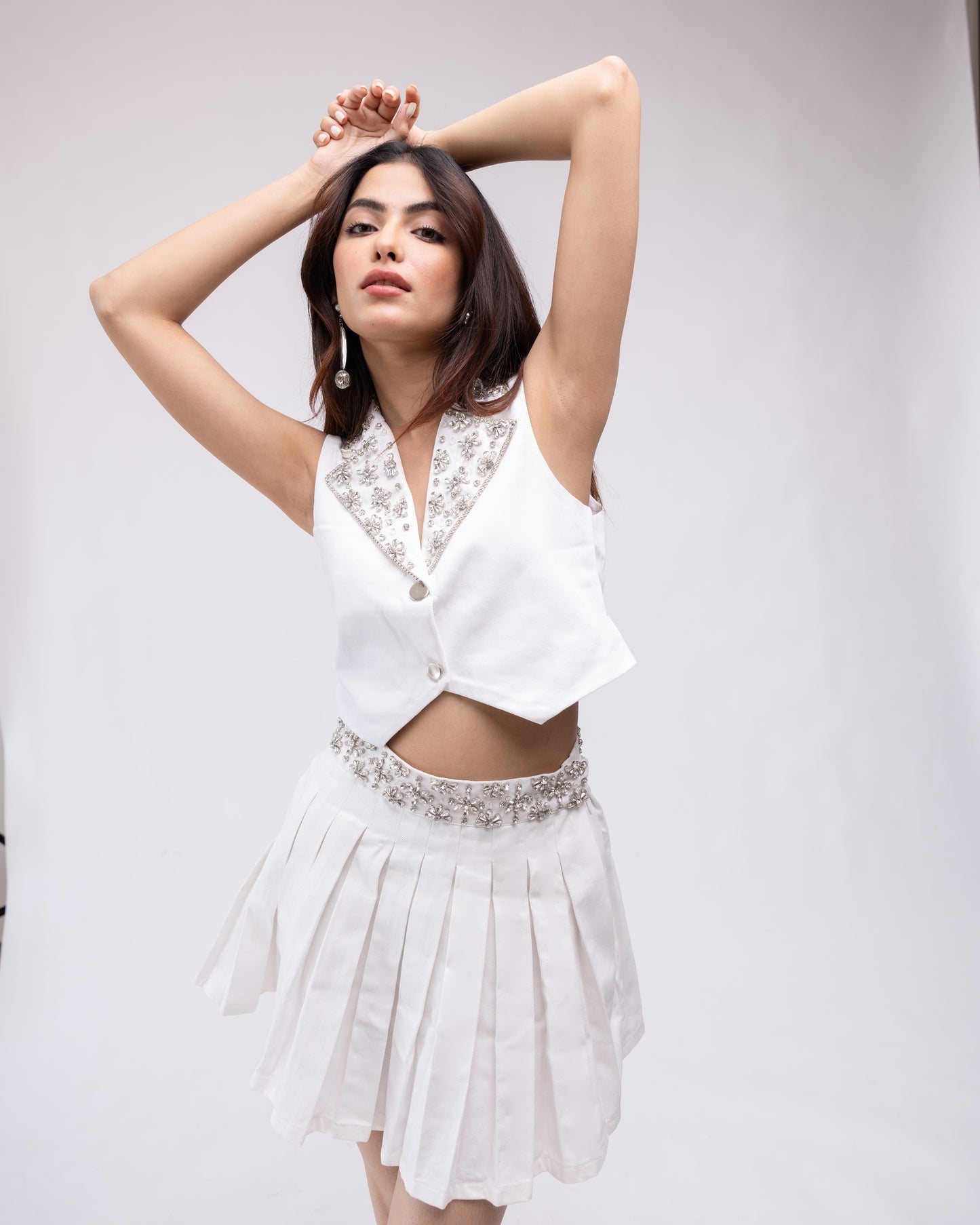 Pleated denim skirt with embellished belt