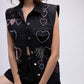 Sleeveless denim jacket with multi-colour embellished hearts