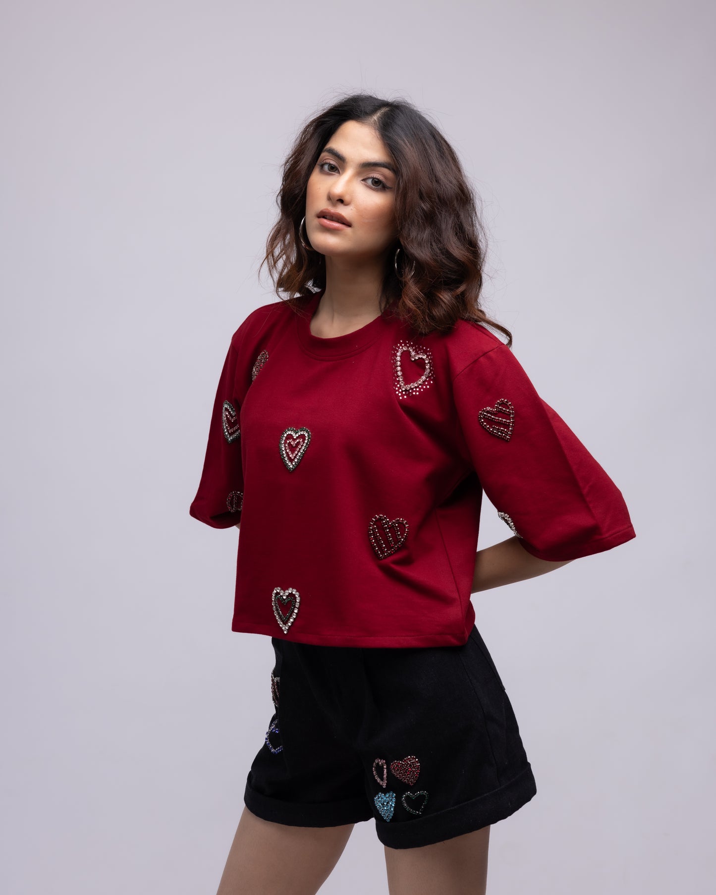 Pleated denim shorts with multi-colour embellished hearts