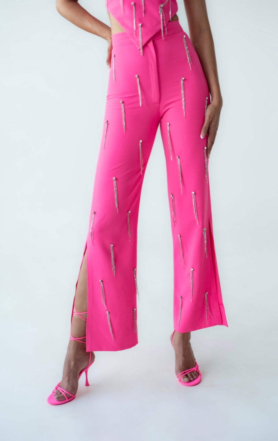 High-waisted embellished trousers with chain detail