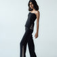 High-waisted straight trousers with slit and chain detail