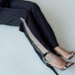 High-waisted straight trousers with slit and chain detail