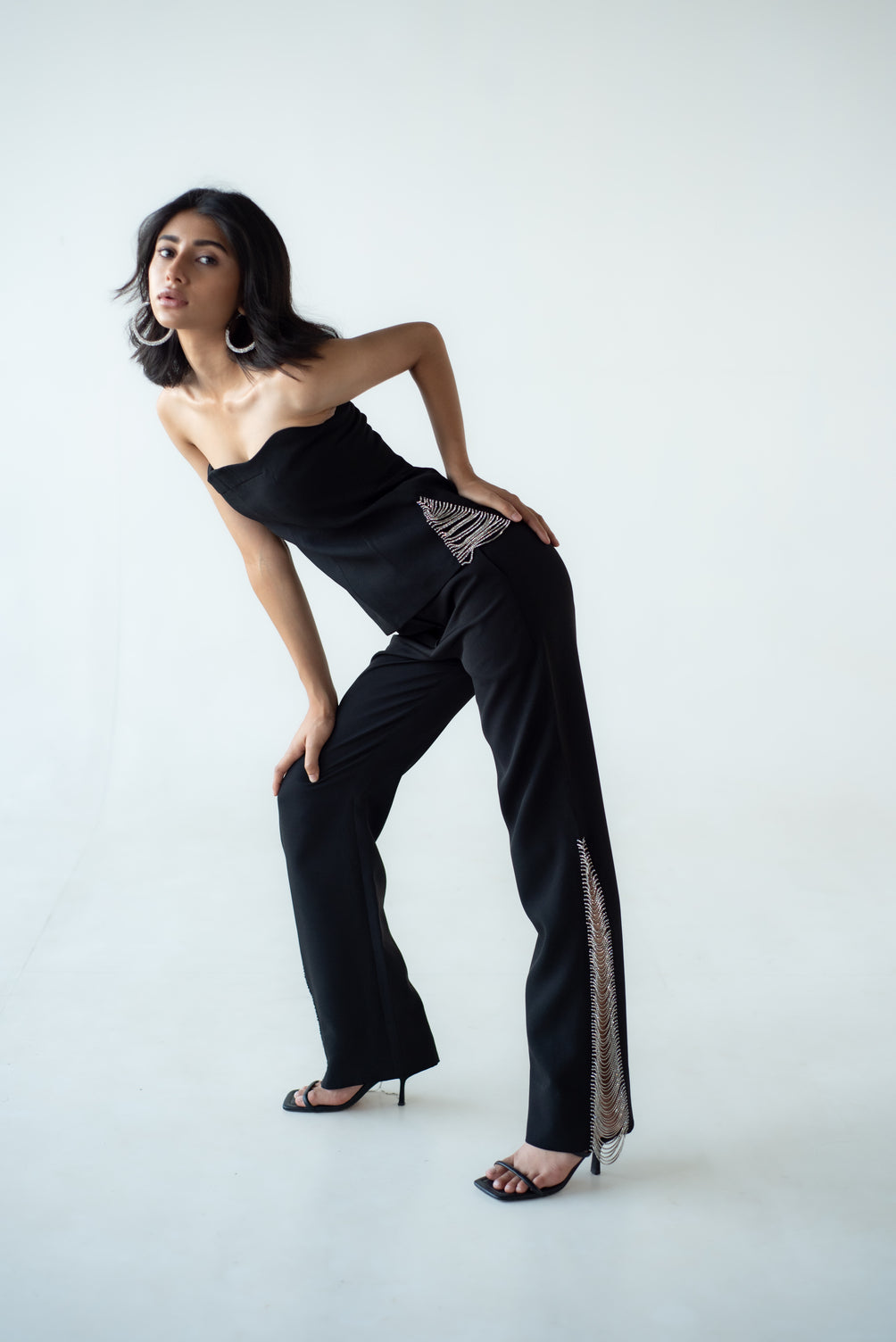 High-waisted straight trousers with slit and chain detail