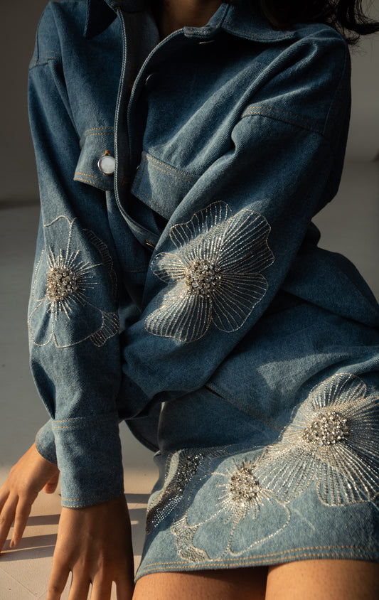 Denim mini skirt with floral embellishments