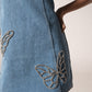 Off-shoulder denim mini with butterflies