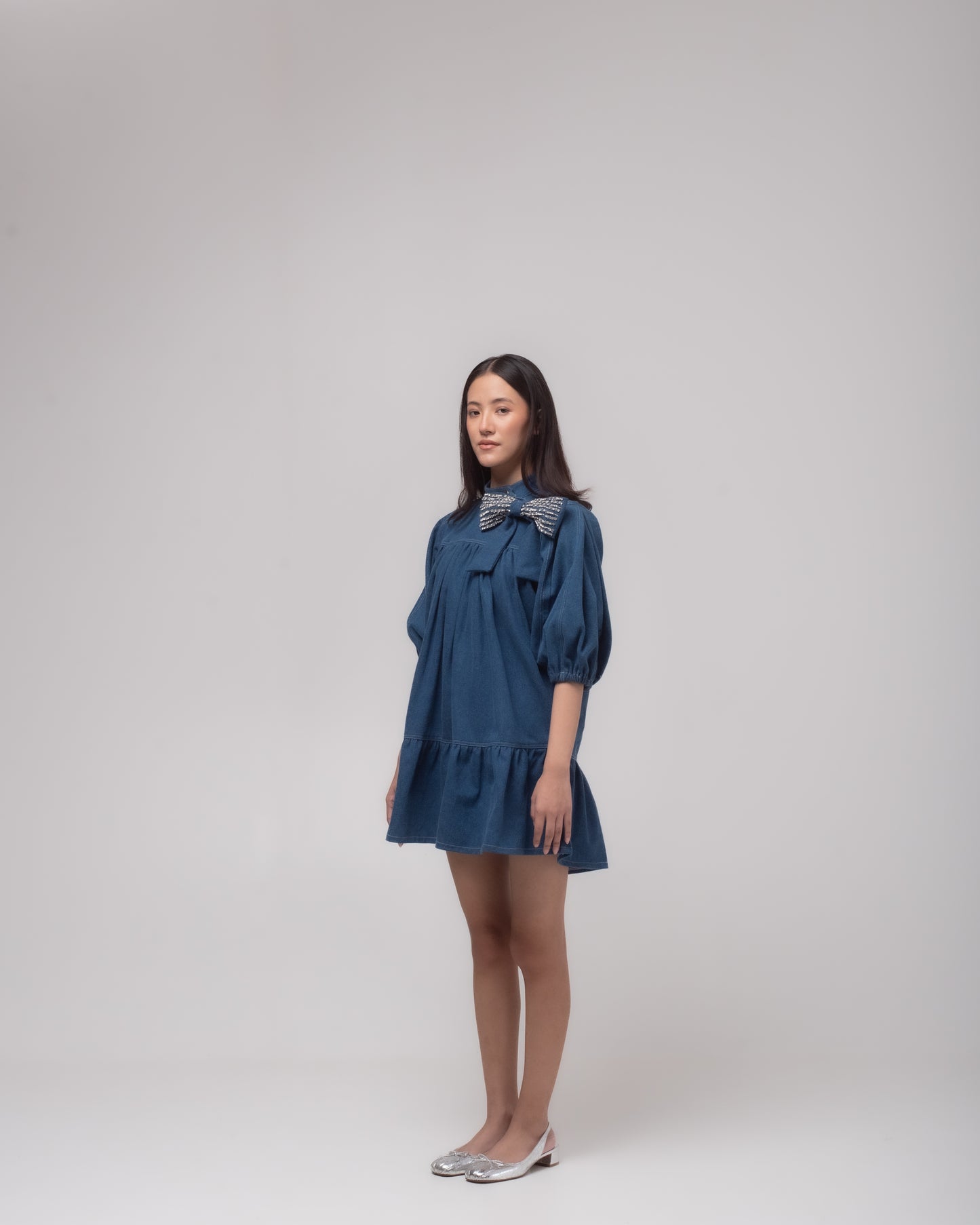 Short denim dress with embellished bow