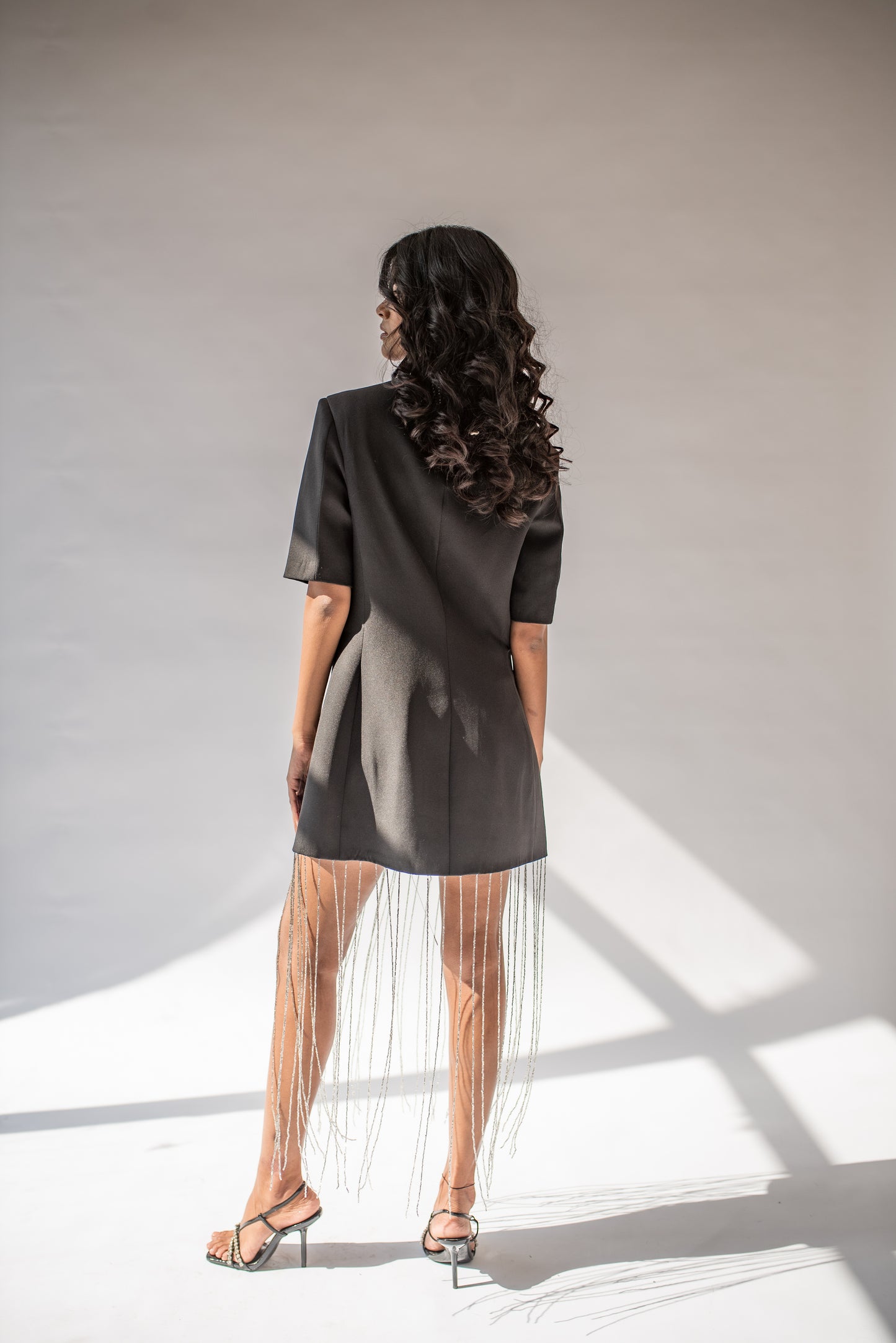Half-sleeved blazer dress with long chain detailing