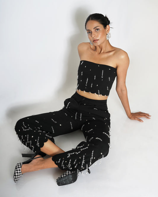 High-waisted trousers with drop embellishments