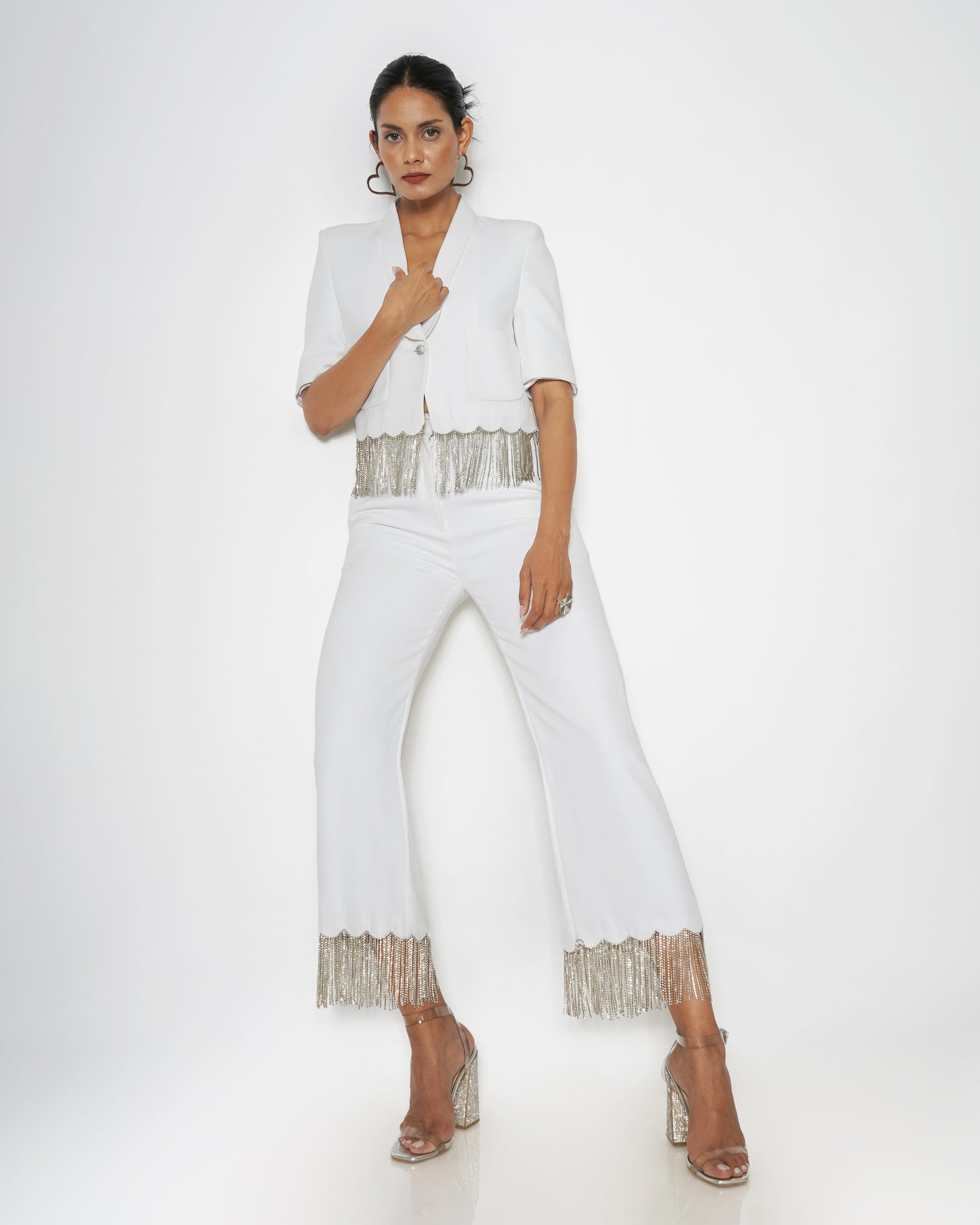 High-waisted trousers with rhinestone chain detail